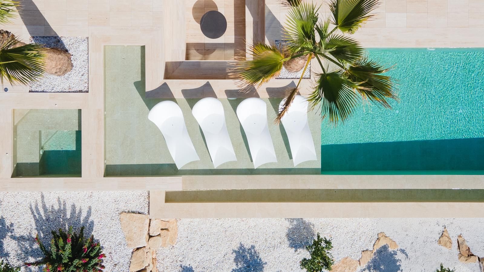 Aerial view of a pool area with surrounding terraces